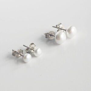Two pairs of sterling silver matching pearl earrings